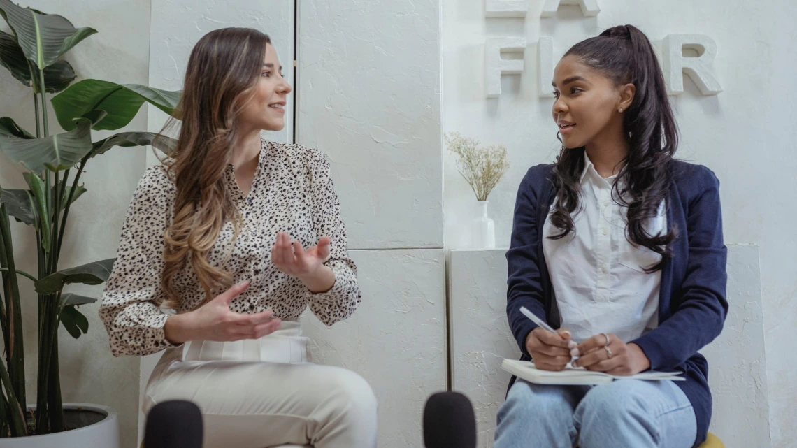 Two ladies talking in a coaching session
